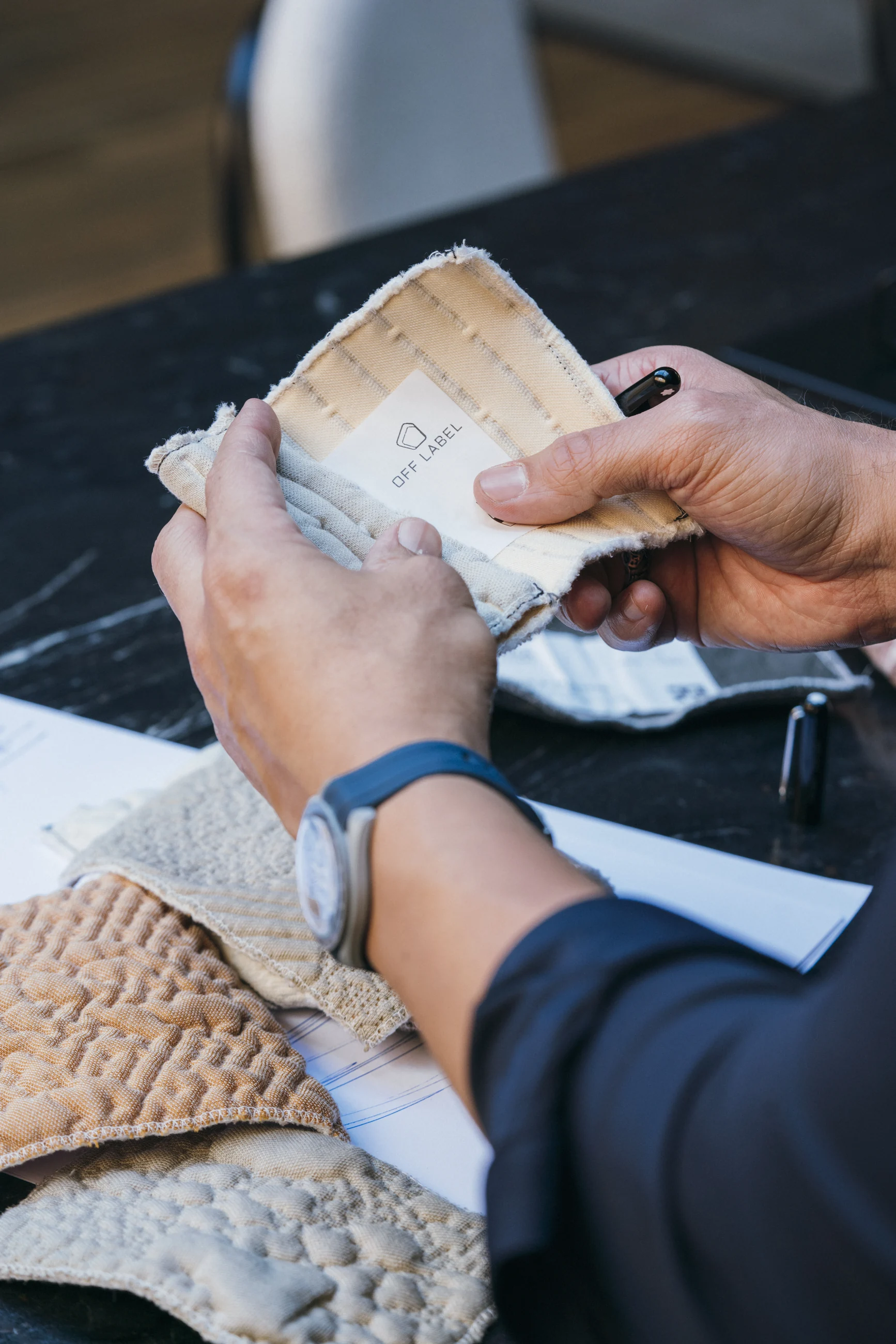André Gurgel examining Off Label textile samples